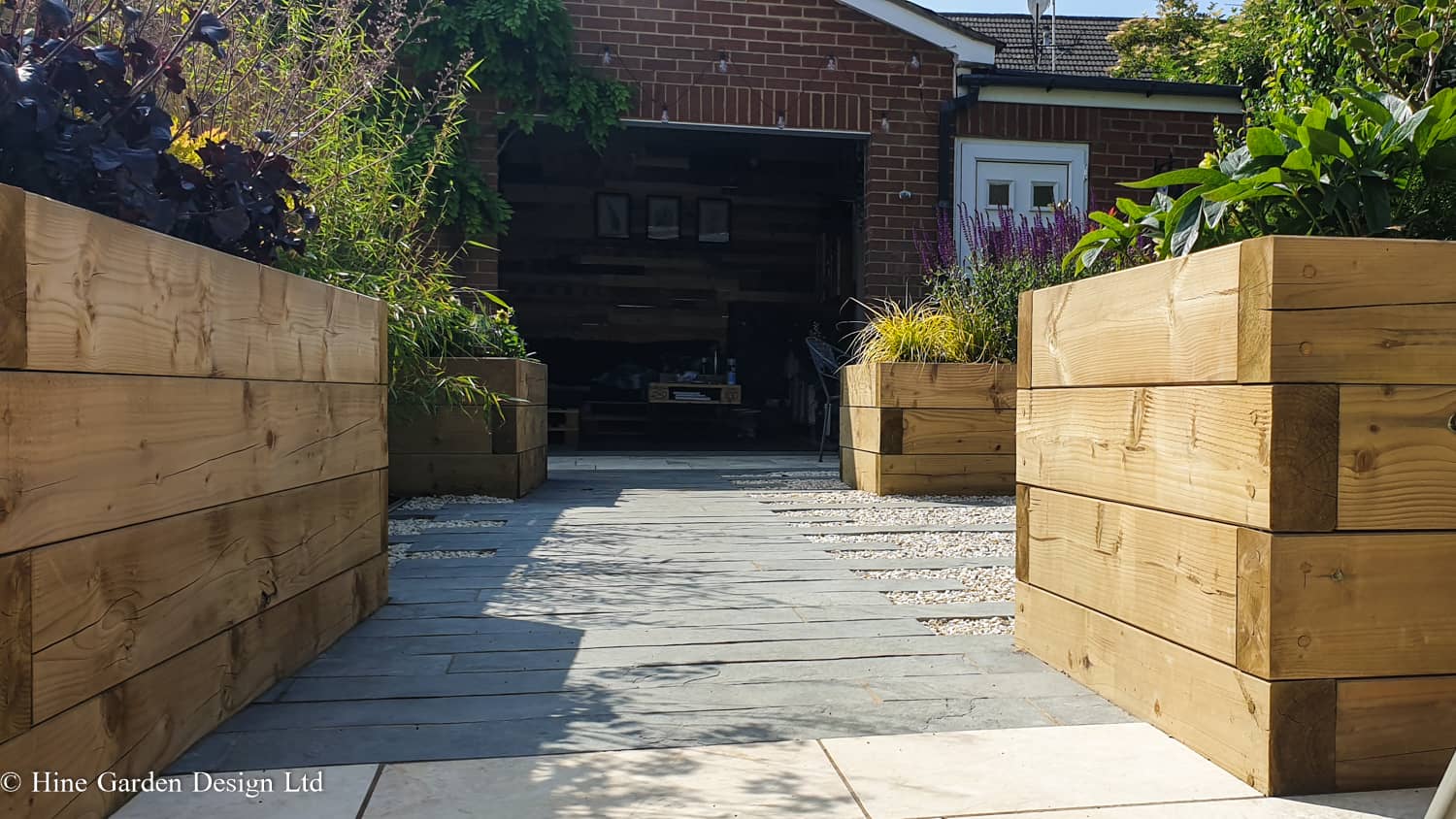 garden spaces created using raised bends and landscaping materials