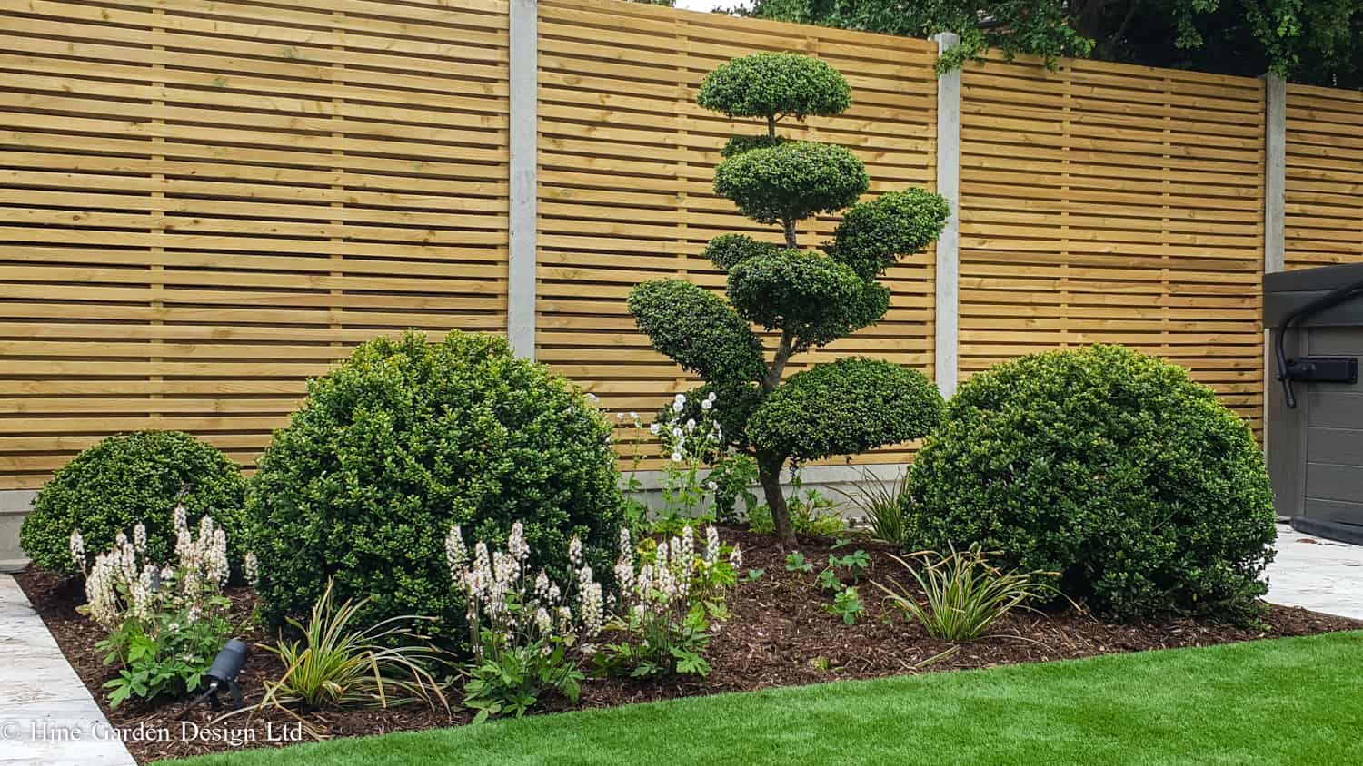 garden design using topiary balls and clouds