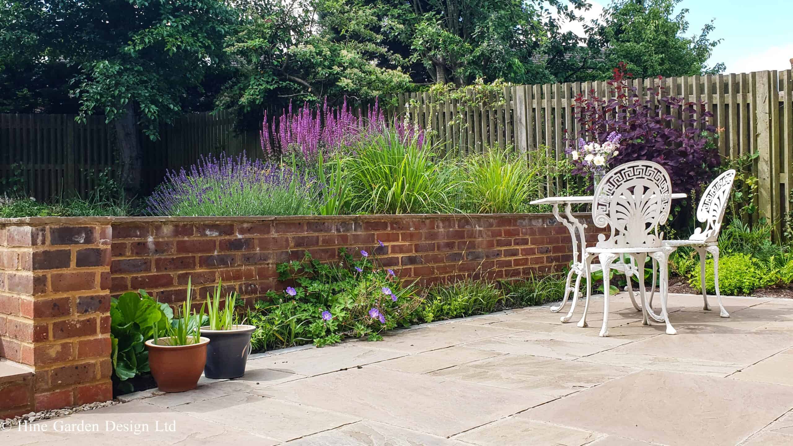 English country garden design brick walls and seating 