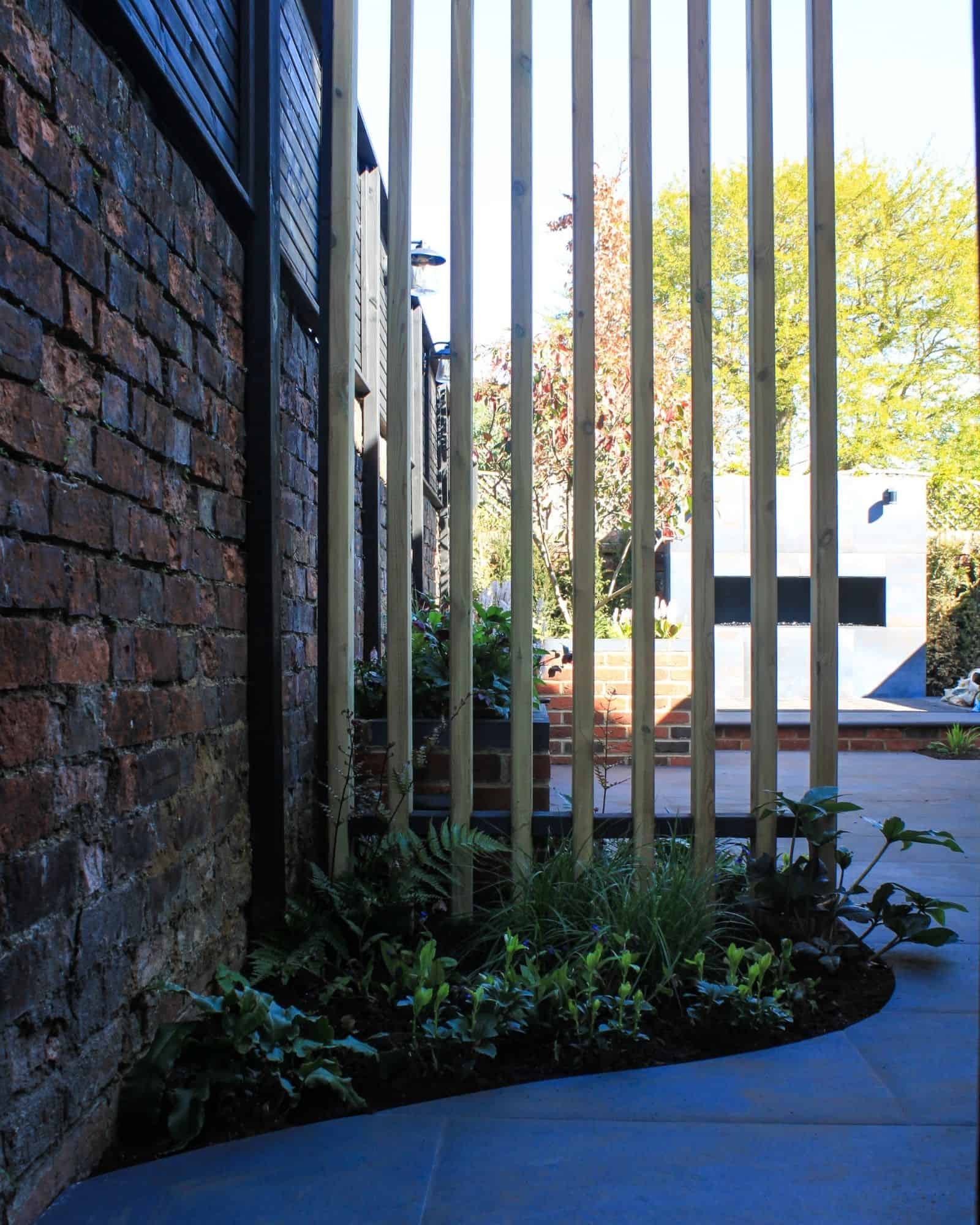 English country garden design brick walls and seating