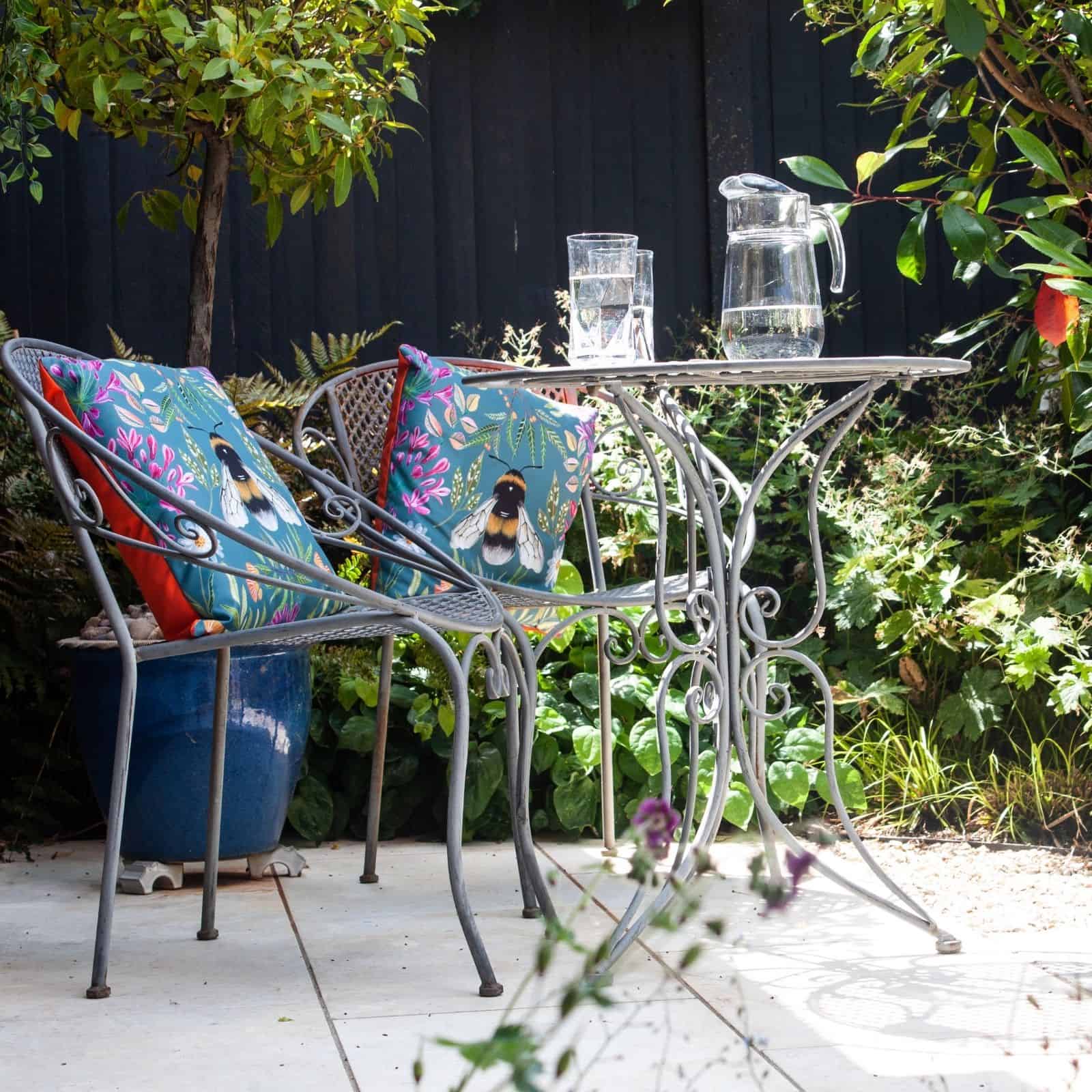 secluded seating area surrounded by planting